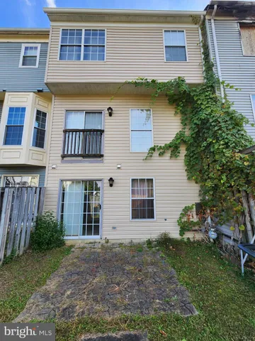 a view of a house with a yard and plants