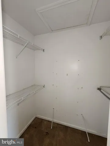 a bathroom with a tub a sink and mirror