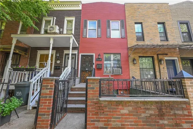front view of a house with a small yard