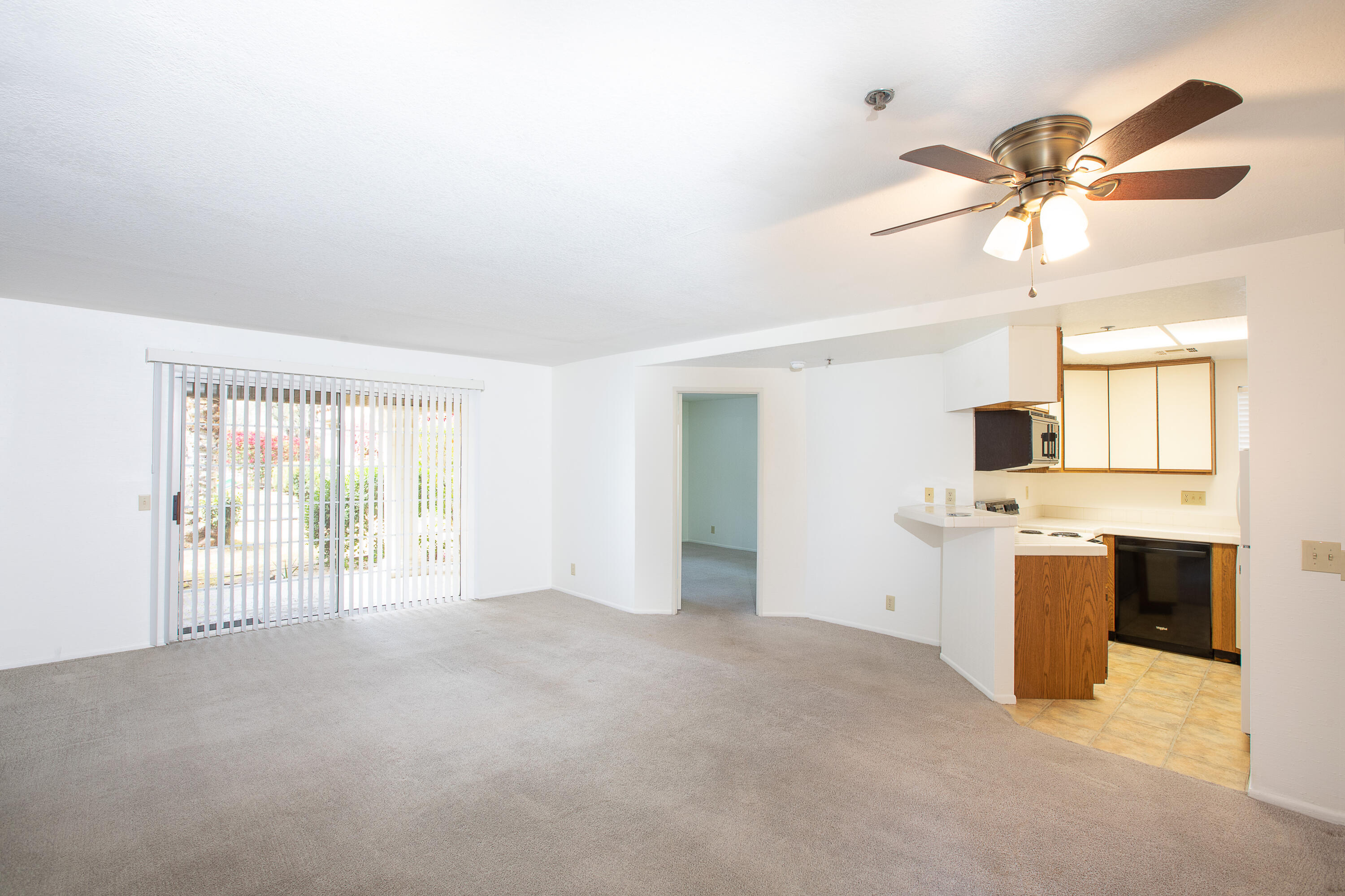 2700 Lawrence Crossley Road, Unit 27 Palm Springs, CA 92264 - Photo 3 of 13 a view of a kitchen with a stove and a window