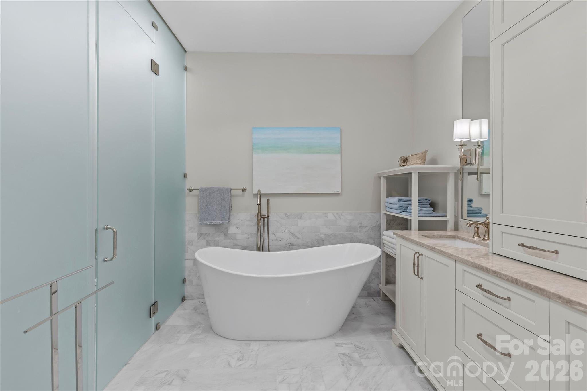 1500 Queens Road, Unit 104 Charlotte, NC 28207 - Photo 27 of 41 a white bath tub sitting next to a white sink
