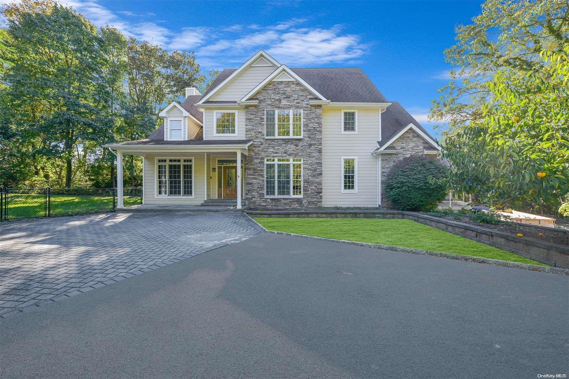 122 Belle Terre Road Port Jefferson, NY 11777 - Photo 1 of 1 a front view of a house with a garden and trees