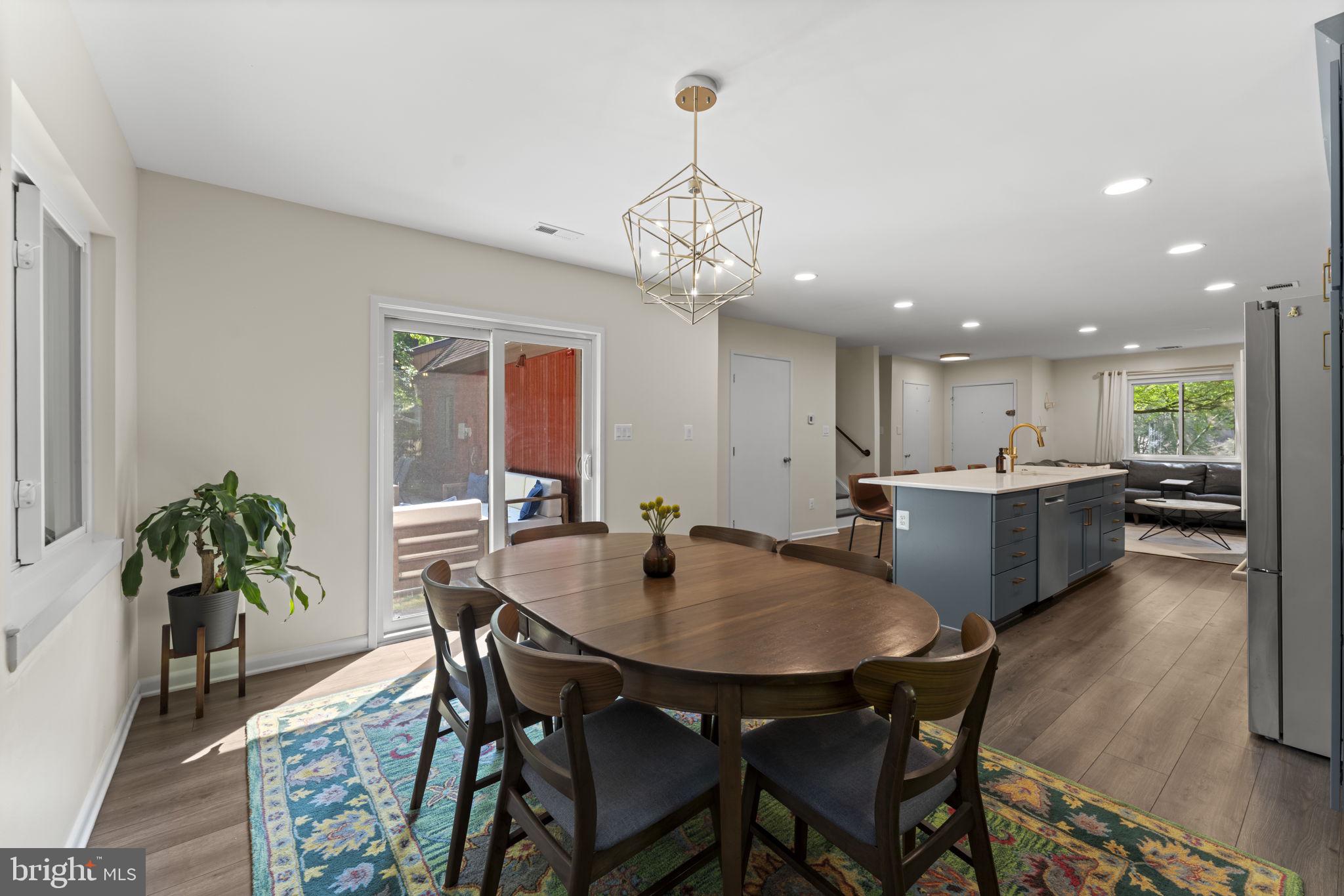11308 Gatesborough Lane Reston, VA 20191 - Photo 13 of 58 a view of a dining room with furniture and wooden floor