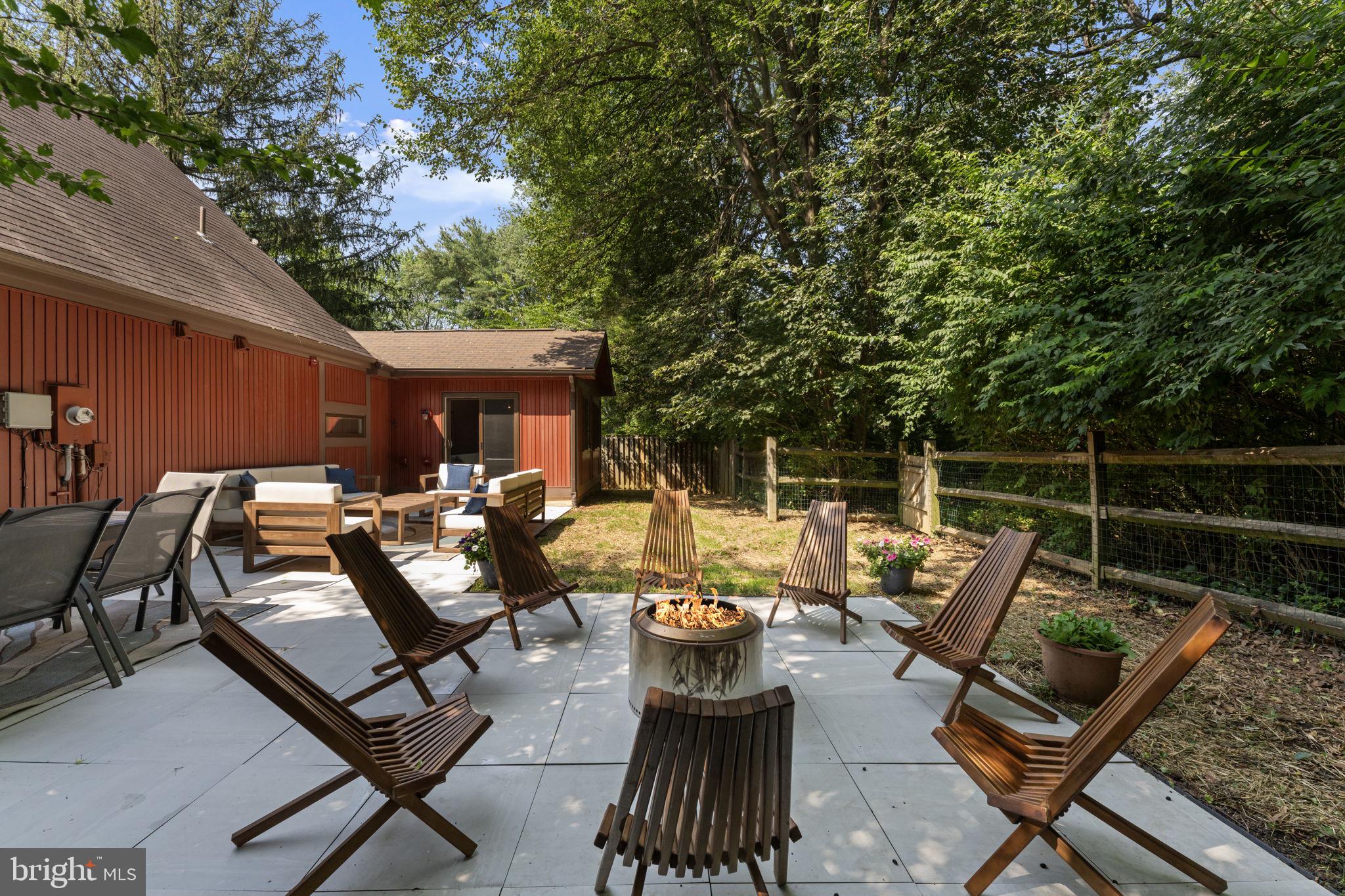 11308 Gatesborough Lane Reston, VA 20191 - Photo 16 of 58 a view of a patio with couches table and chairs and potted plants