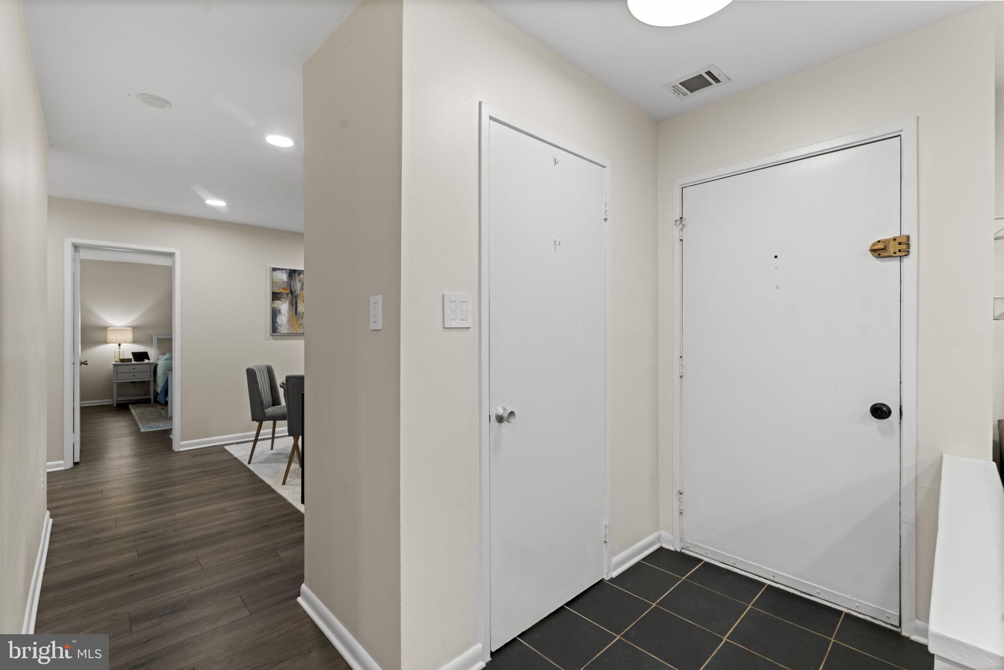 11308 Gatesborough Lane Reston, VA 20191 - Photo 18 of 58 a view of a hallway with wooden floor and closet area