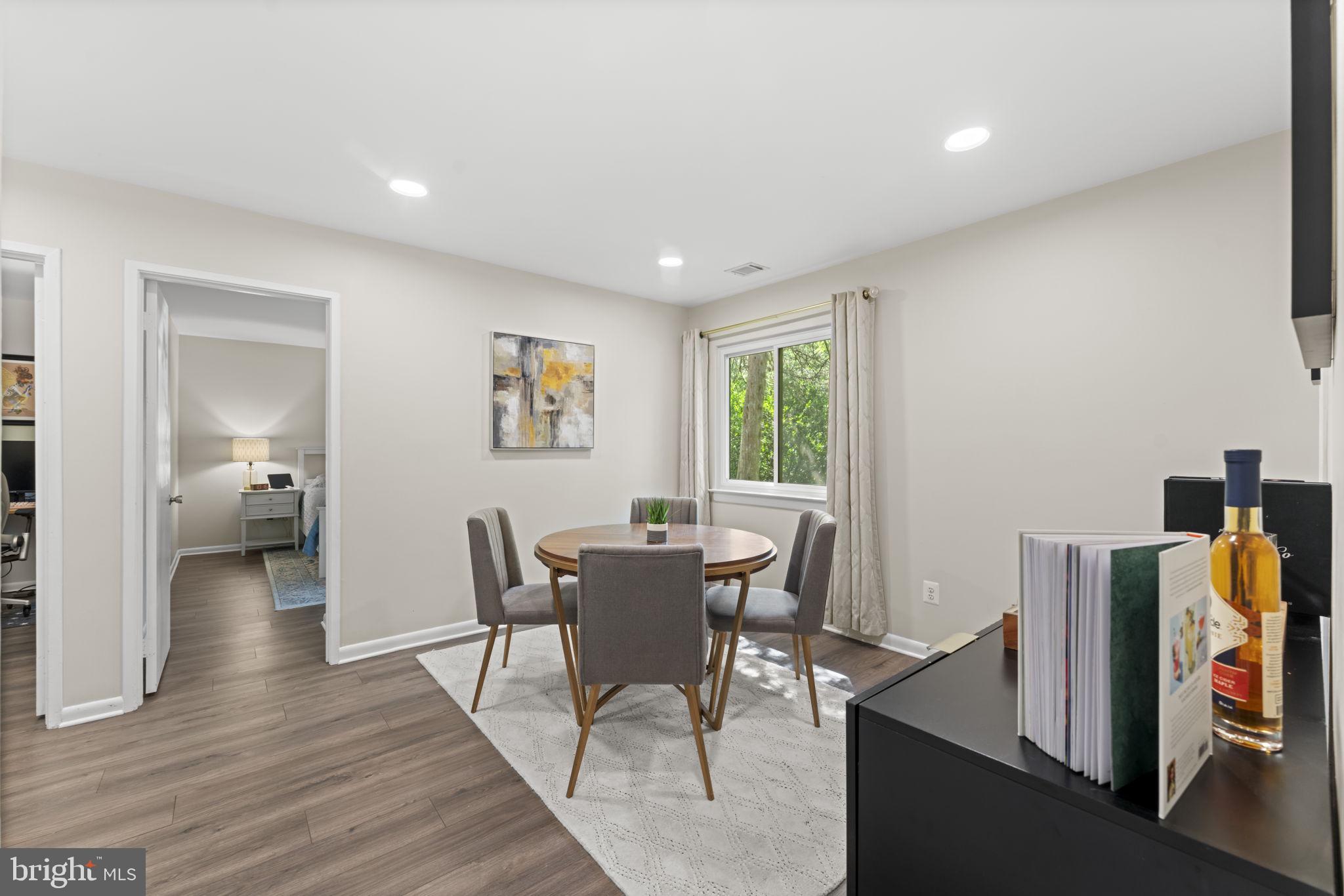 11308 Gatesborough Lane Reston, VA 20191 - Photo 19 of 58 a view of a dining room with furniture and a window