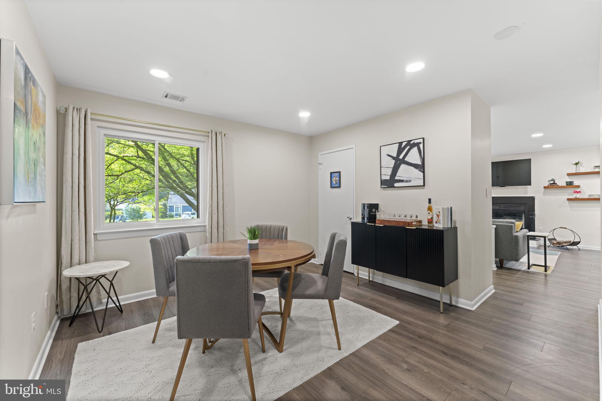 11308 Gatesborough Lane Reston, VA 20191 - Photo 20 of 58 a living room with furniture and a large window