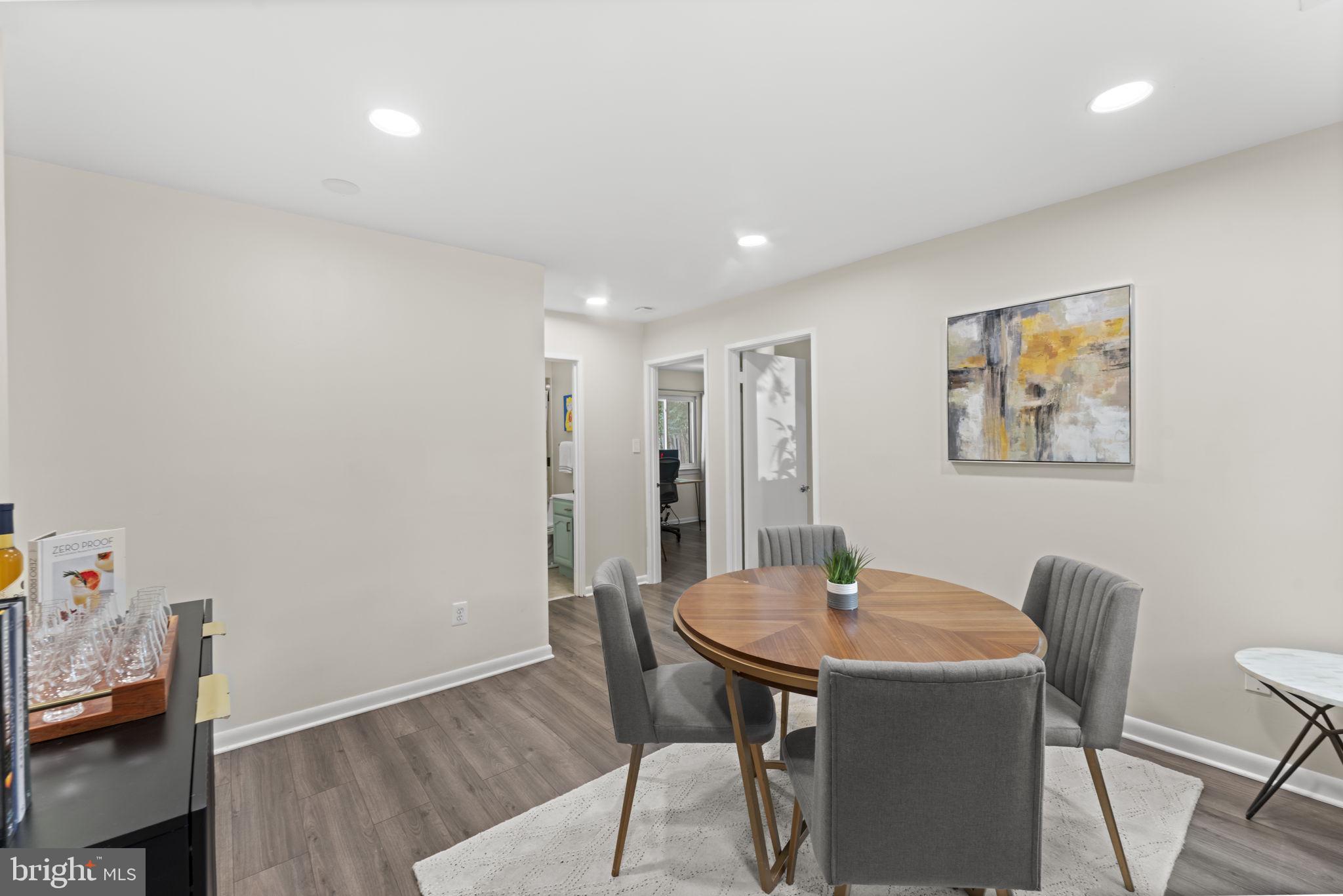 11308 Gatesborough Lane Reston, VA 20191 - Photo 21 of 58 a view of a dining room with furniture and wooden floor