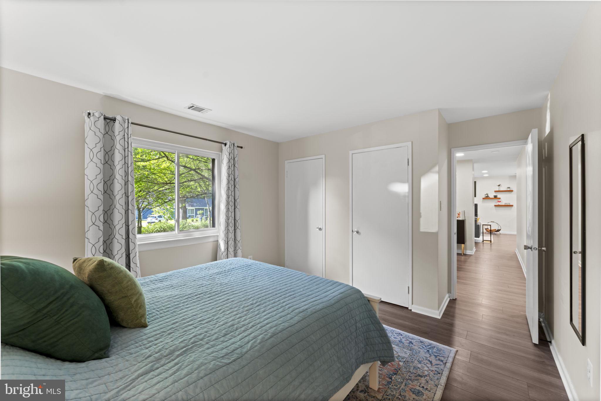 11308 Gatesborough Lane Reston, VA 20191 - Photo 25 of 58 a bedroom with a bed and a window