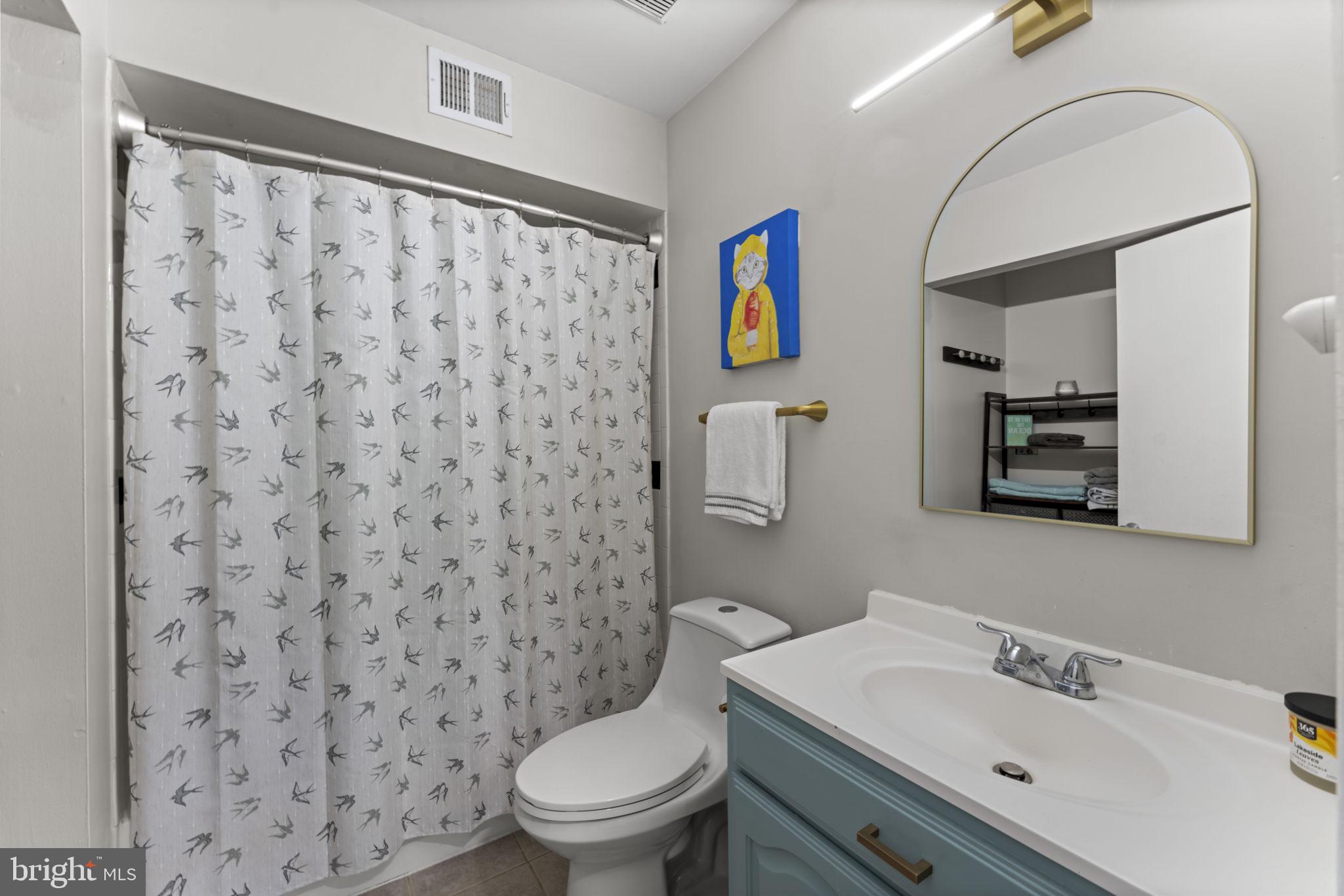 11308 Gatesborough Lane Reston, VA 20191 - Photo 26 of 58 a bathroom with a toilet sink and mirror