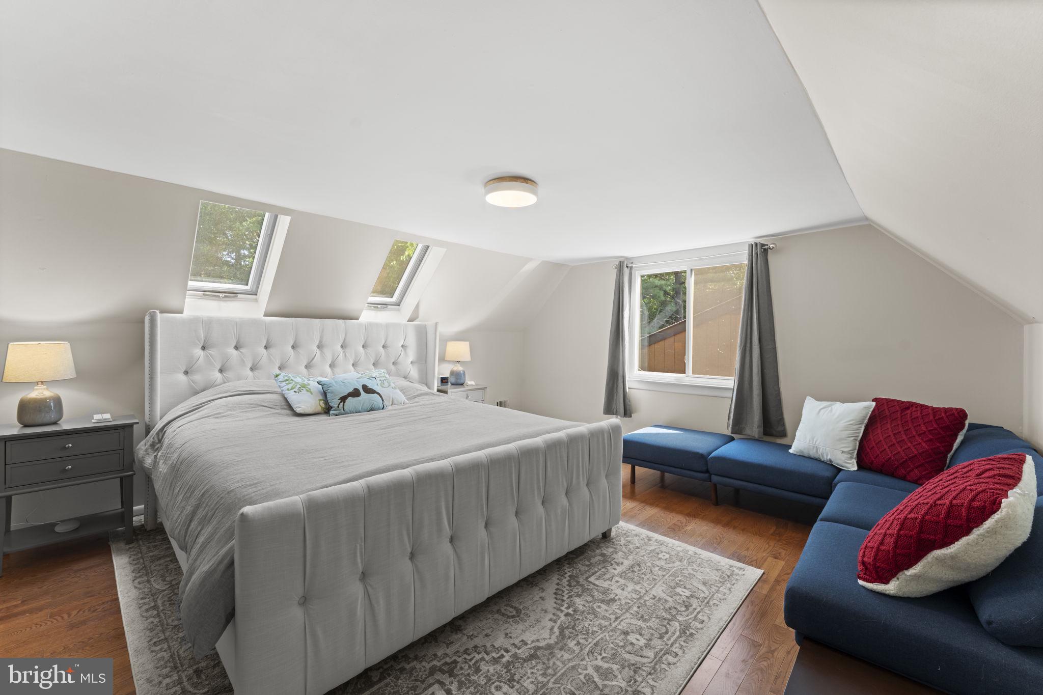 11308 Gatesborough Lane Reston, VA 20191 - Photo 30 of 58 a bedroom with a bed and couch