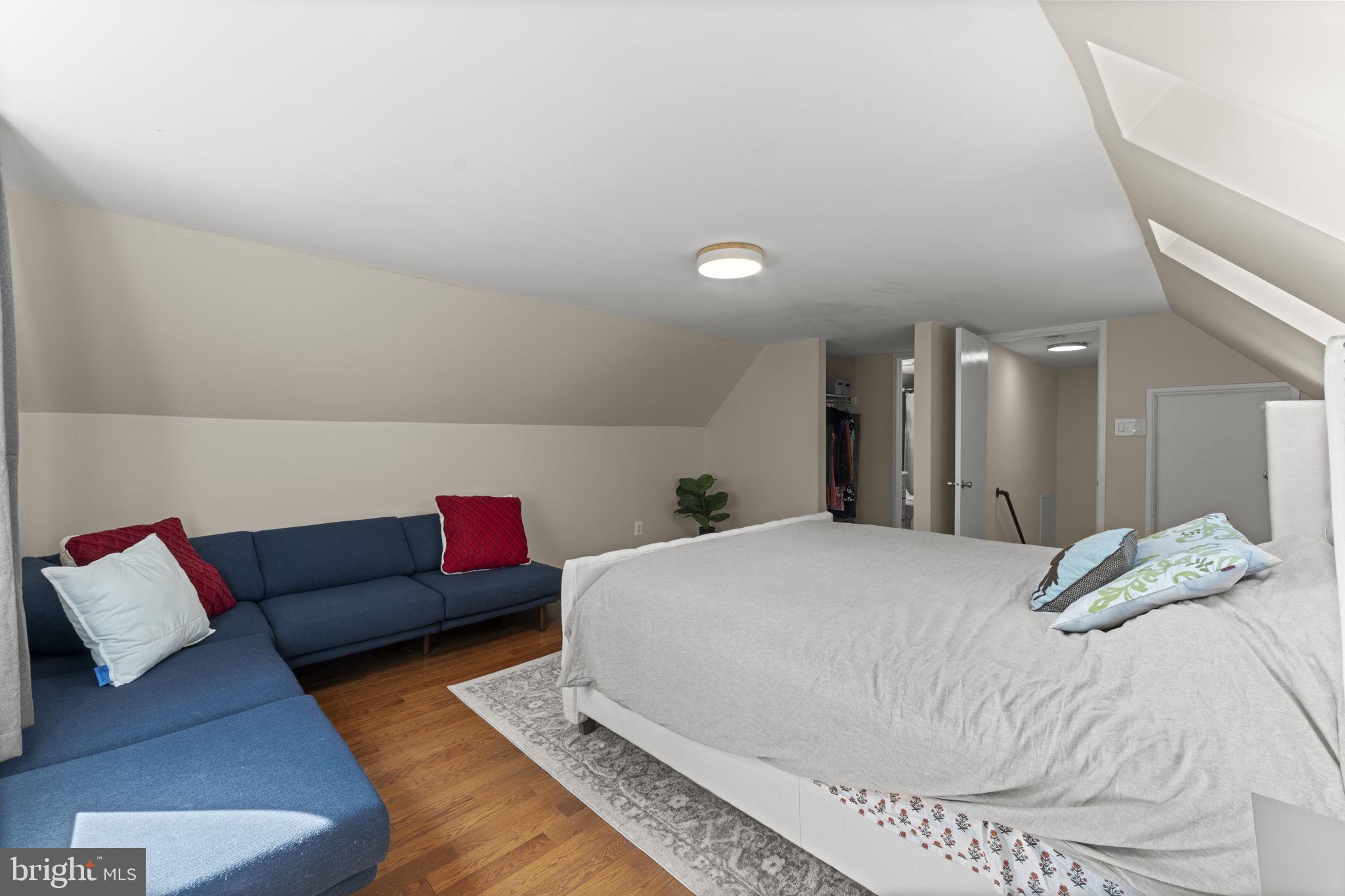 11308 Gatesborough Lane Reston, VA 20191 - Photo 31 of 58 a bedroom with a bed and couch