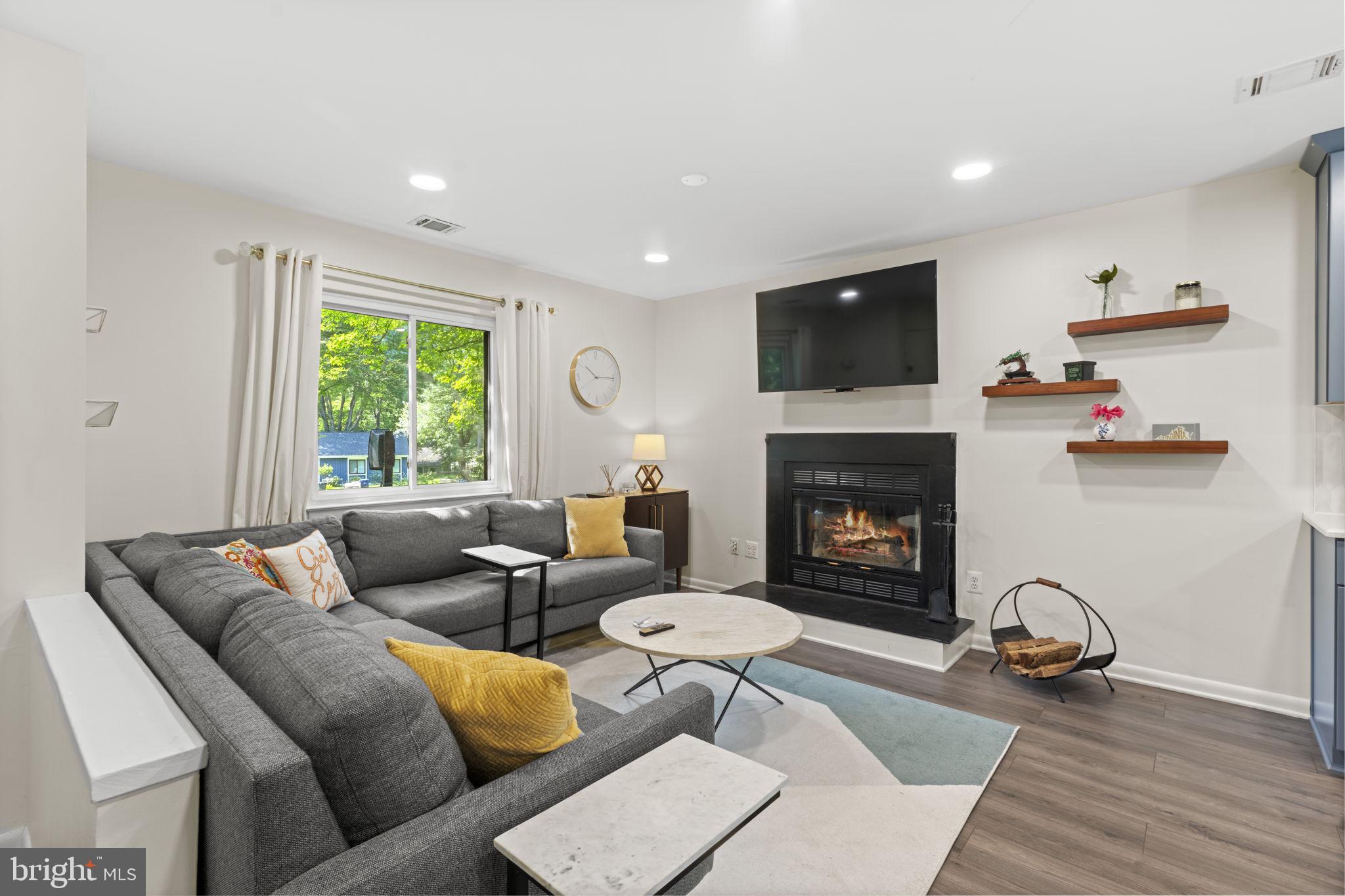 11308 Gatesborough Lane Reston, VA 20191 - Photo 5 of 58 a living room with furniture and a fireplace