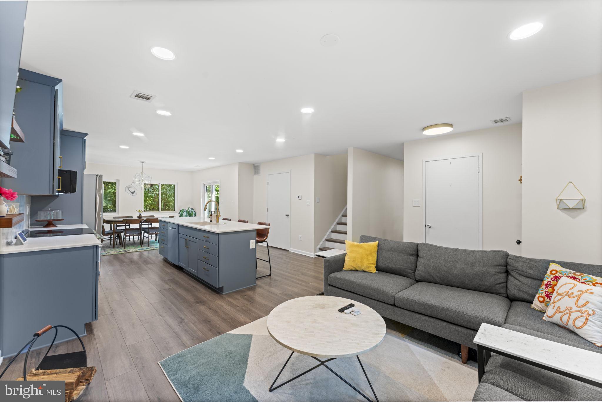 11308 Gatesborough Lane Reston, VA 20191 - Photo 6 of 58 a living room with furniture and kitchen view