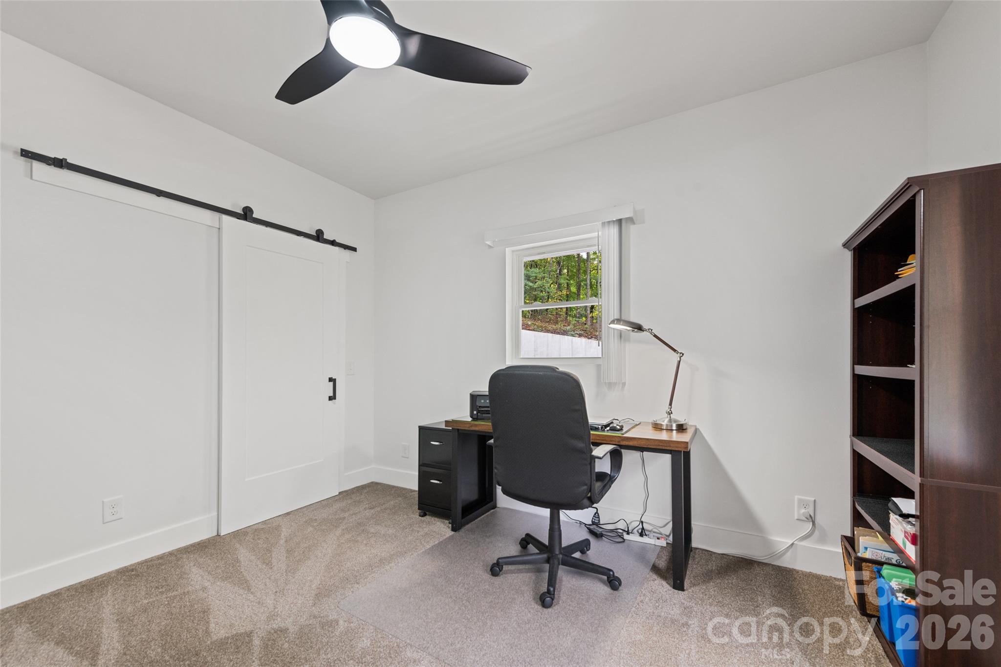 1185 Wallalieu Road Otto, NC 28763 - Photo 27 of 43 a view of a workspace with furniture and a window