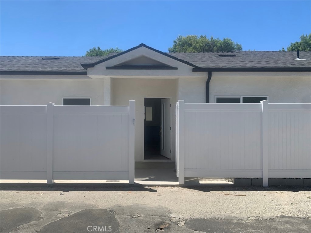 19509 Enadia Way Reseda, CA 91335 - Photo 6 of 15 a front view of a house with a yard