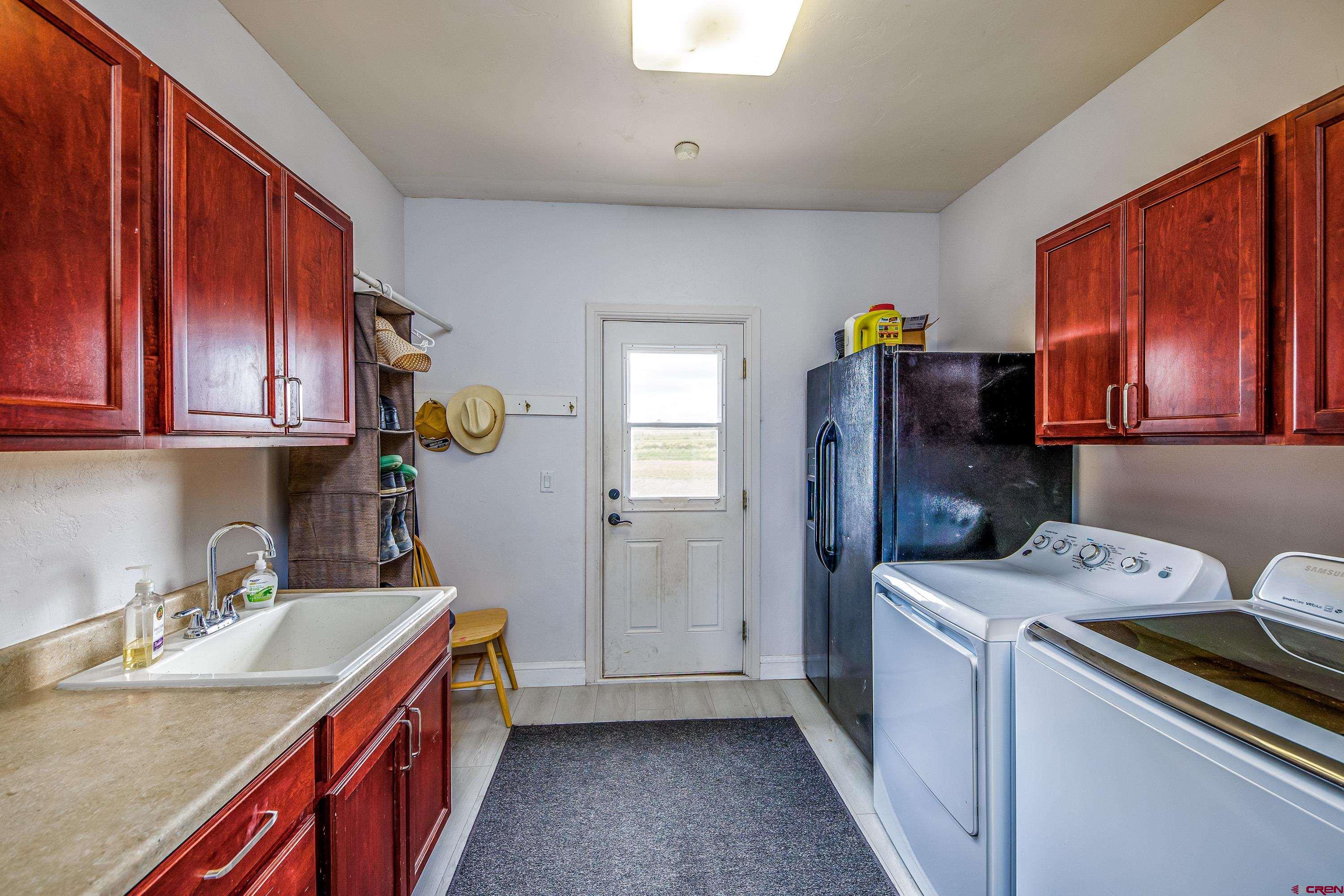 69392 Racine Road Montrose, CO 81401 - Photo 30 of 32 a utility room with dryer and washer