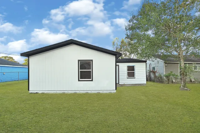 a view of a backyard of the house