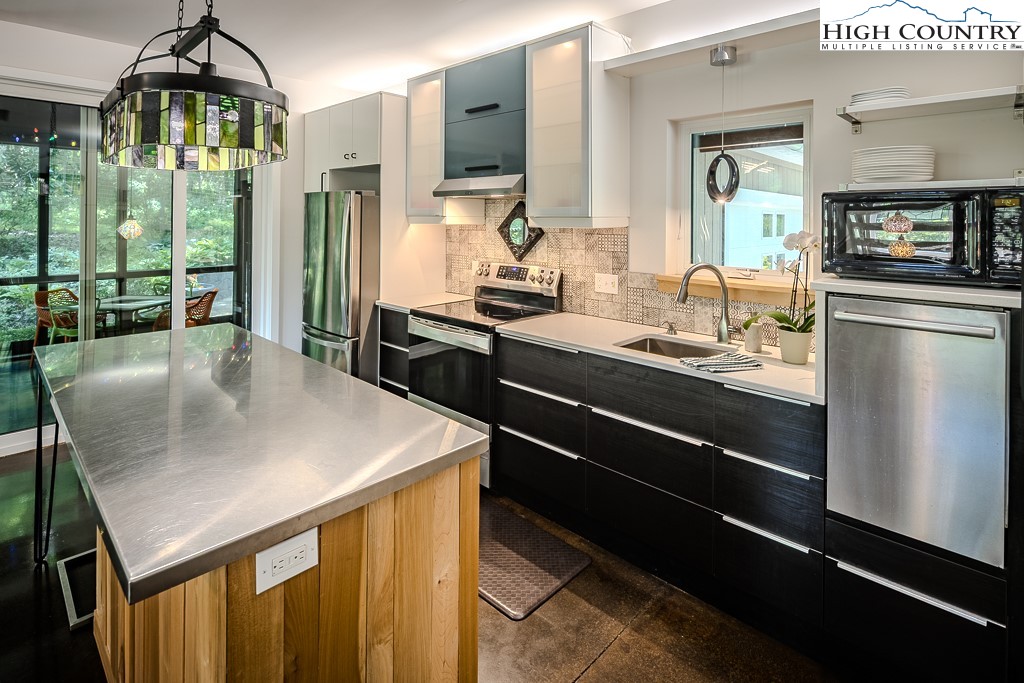 314 Hillandale Drive Boone, NC 28607 - Photo 16 of 49 a kitchen with counter top space and stainless steel appliances