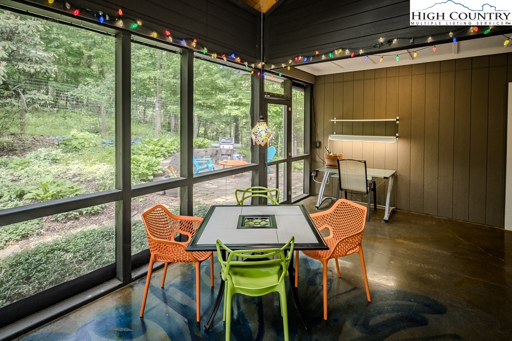 314 Hillandale Drive Boone, NC 28607 - Photo 19 of 49 a view of a dining room with furniture a chandelier and wooden floor