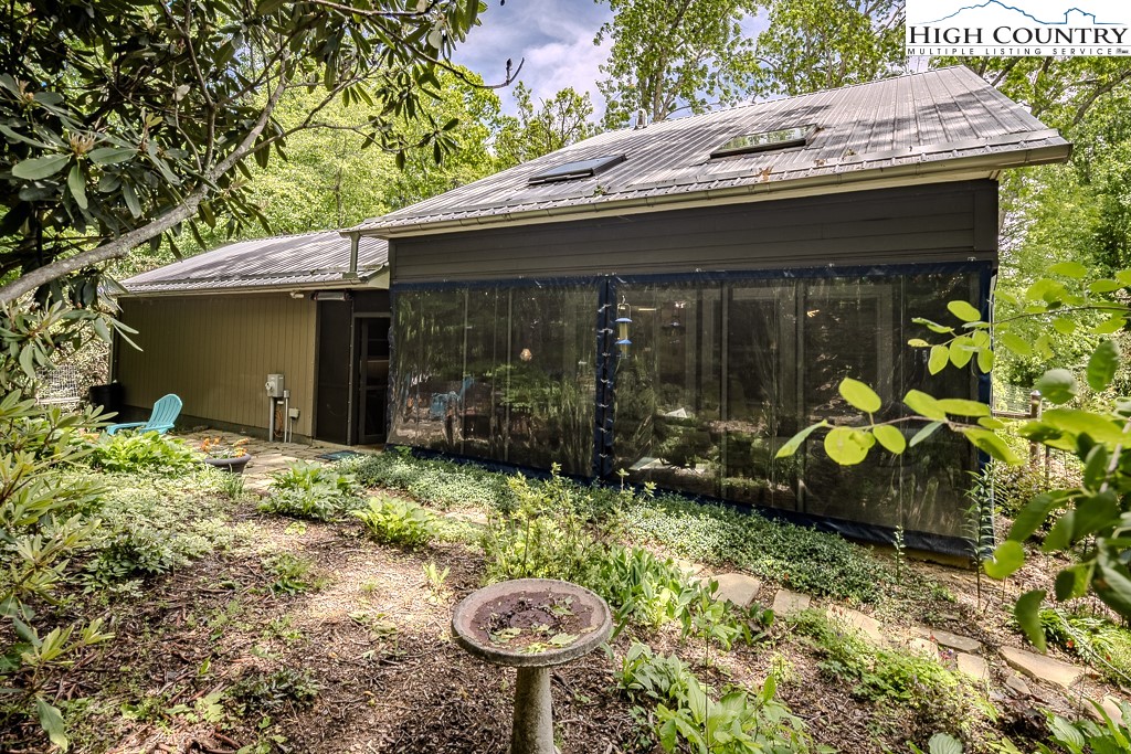 314 Hillandale Drive Boone, NC 28607 - Photo 22 of 49 a view of a chair and table in the garden