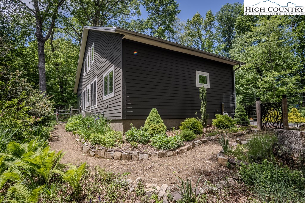 314 Hillandale Drive Boone, NC 28607 - Photo 24 of 49 a front view of a house with garden