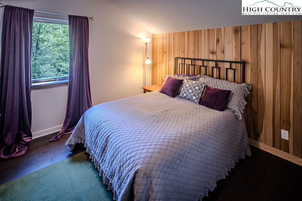 314 Hillandale Drive Boone, NC 28607 - Photo 37 of 49 a bed sitting in a bedroom next to a window