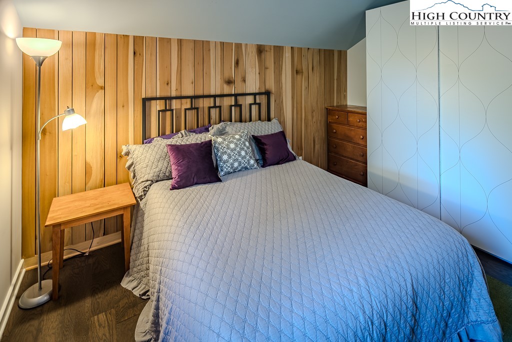 314 Hillandale Drive Boone, NC 28607 - Photo 39 of 49 a bedroom with a bed and wooden floor