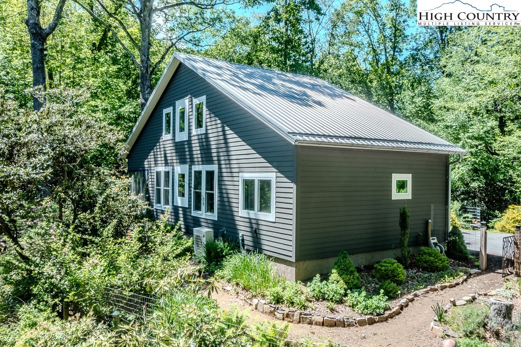 314 Hillandale Drive Boone, NC 28607 - Photo 48 of 49 a view of a house with brick walls and plants