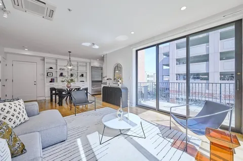 a living room with furniture and a table