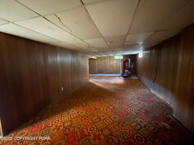 a view of hallway with an empty room