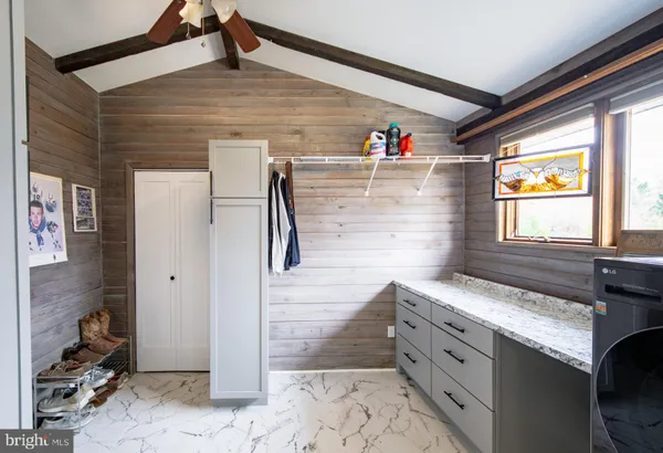 a view of livingroom with washer and dryer