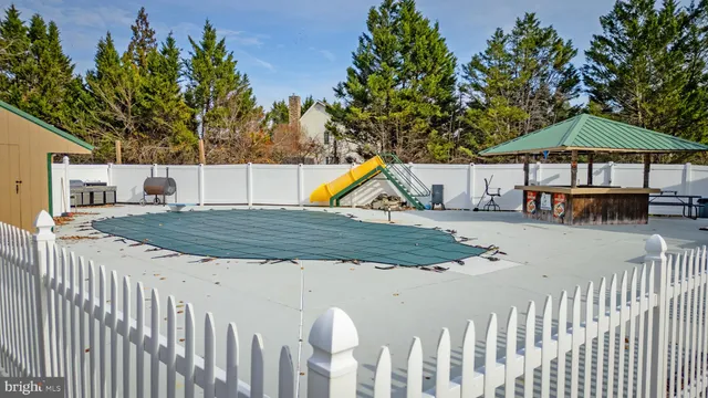 a utility room with furniture and clutter