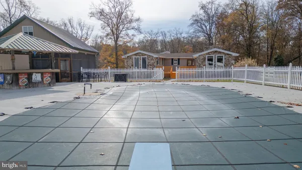 an aerial view of residential house with outdoor space