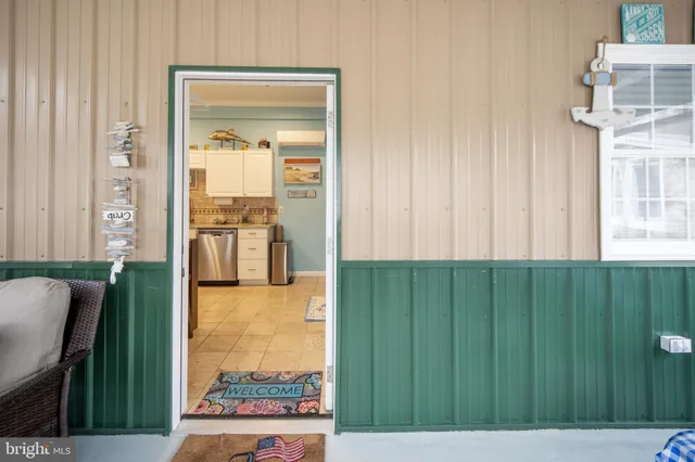 a kitchen with a sink and a stove top oven