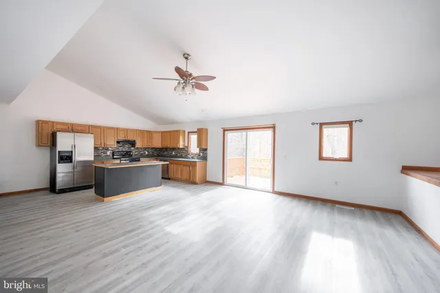 a room with cabinets and washer