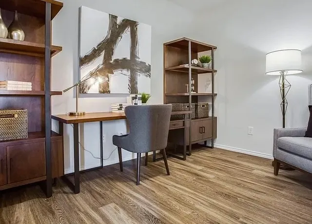 a workspace with furniture and wooden floor