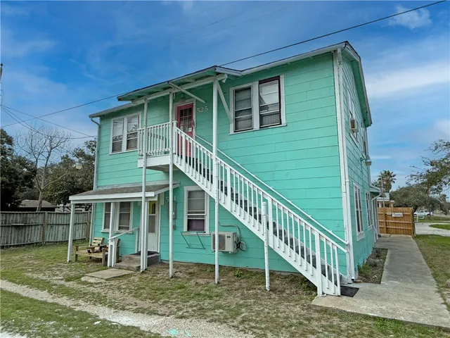 a backyard of a house with seating space