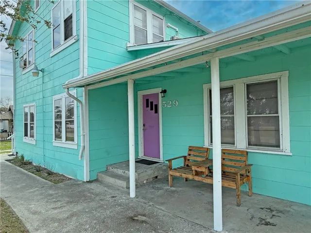 a bedroom with a bed ceiling fan and a window
