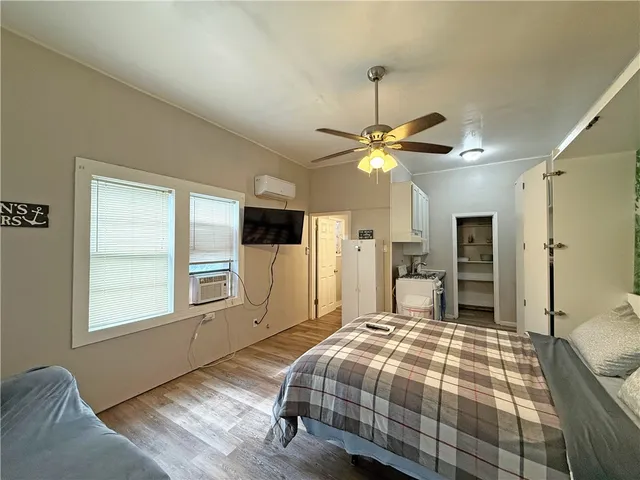 a kitchen with stainless steel appliances kitchen island granite countertop a sink stove and cabinets