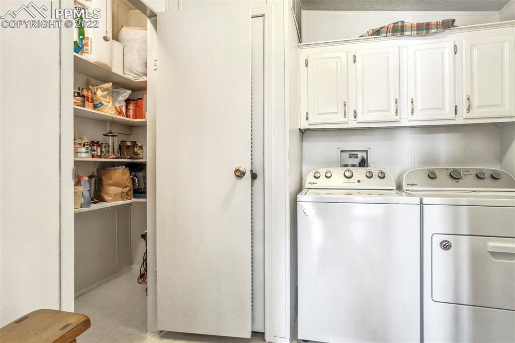 39875 Judge Orr Road Rush, CO 80833 - Photo 28 of 47 a white refrigerator freezer sitting inside of a kitchen