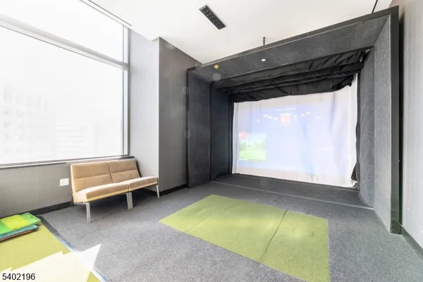 a large room with lots of counter space and windows