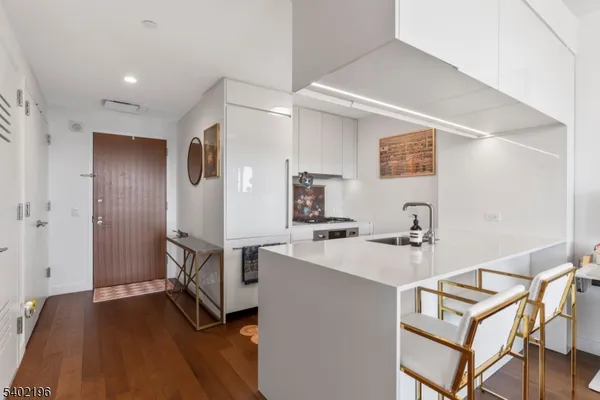 a kitchen with a sink and a refrigerator