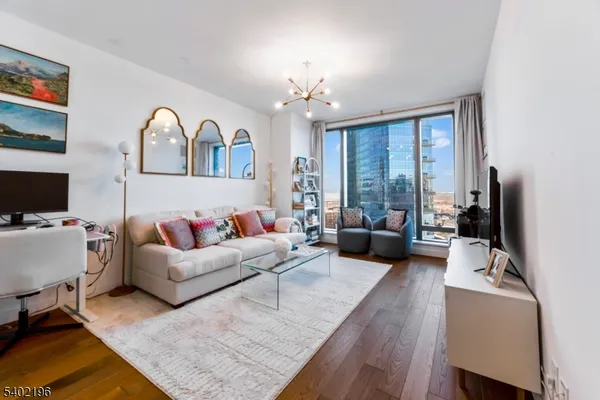 a living room with furniture fireplace and flat screen tv