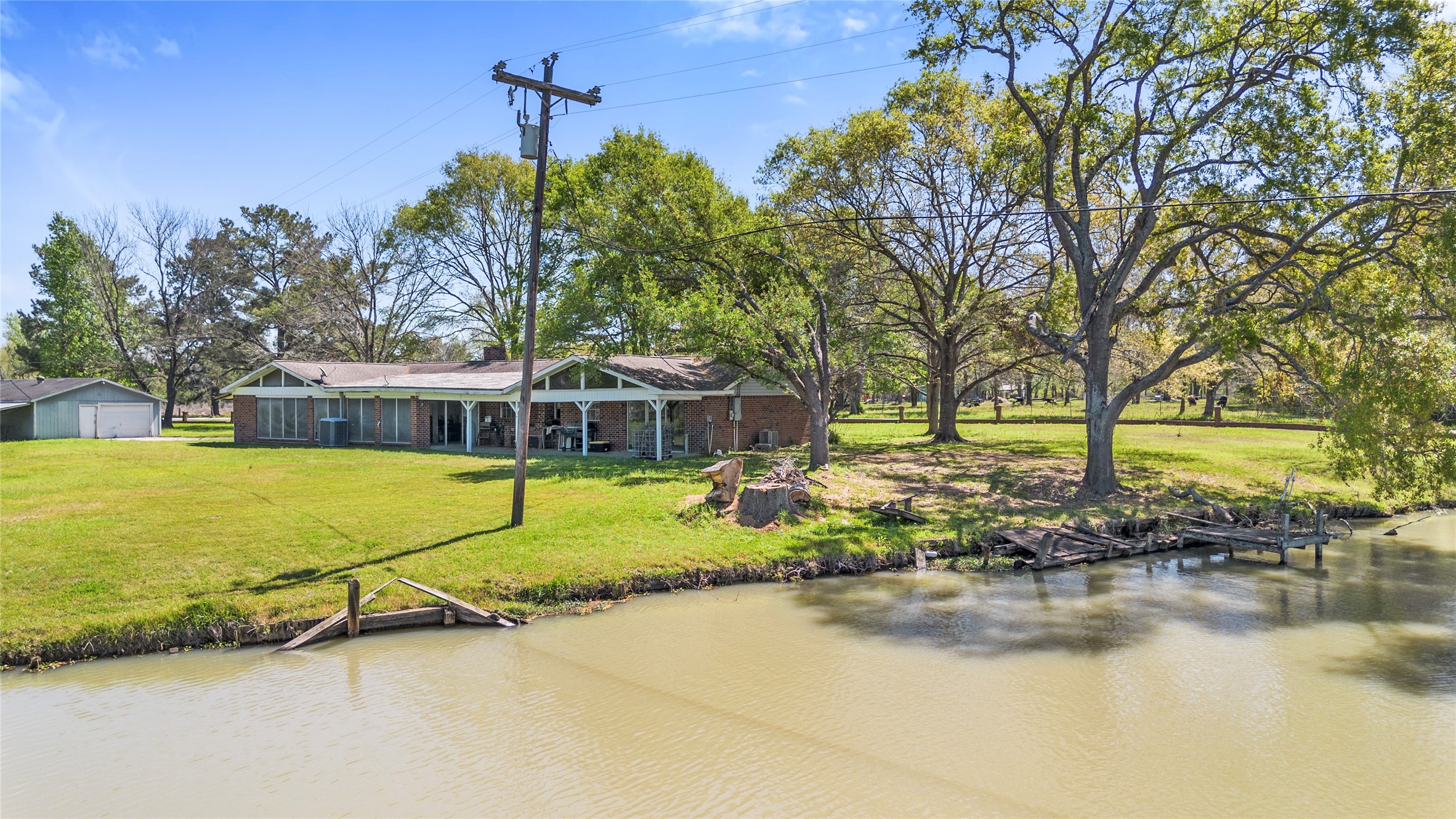 1633 River Road Goodrich, TX 77335 - Photo 3 of 7 a swimming pool with outdoor seating and yard