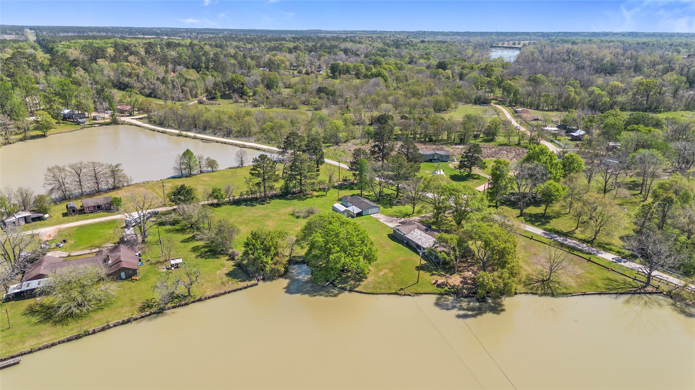 1633 River Road Goodrich, TX 77335 - Photo 5 of 7 an aerial view of a house with a yard