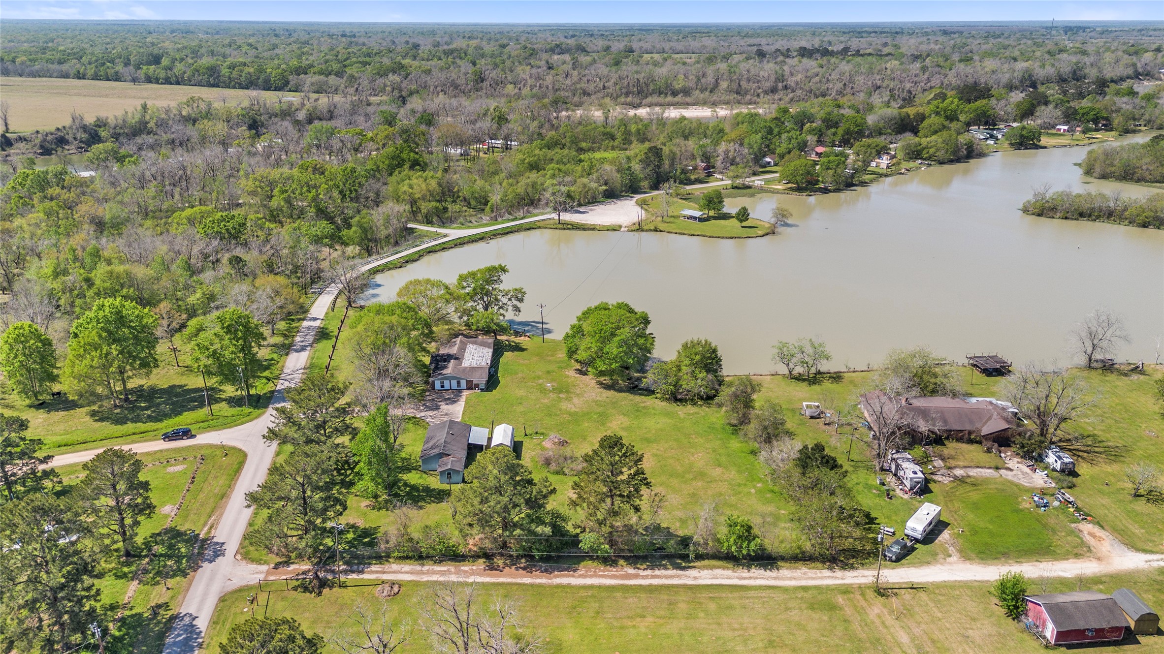 1633 River Road Goodrich, TX 77335 - Photo 6 of 7 an aerial view of lake residential house with outdoor space