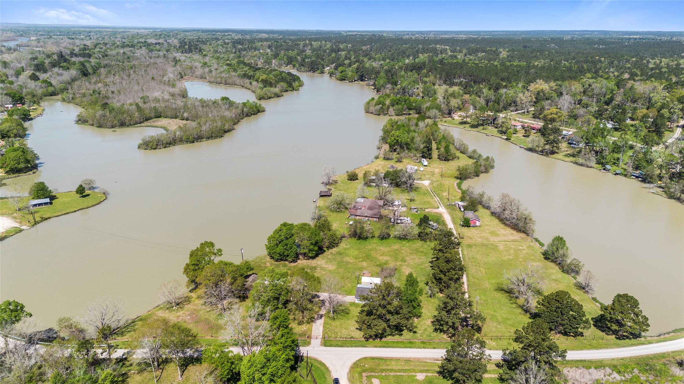 1633 River Road Goodrich, TX 77335 - Photo 7 of 7 an aerial view of lake residential house with swimming pool