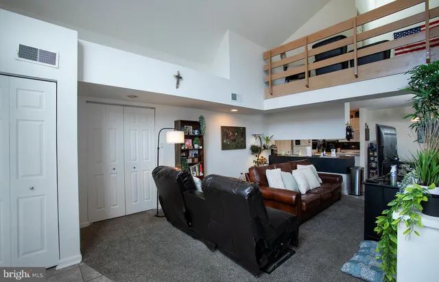 a living room with furniture and a couch