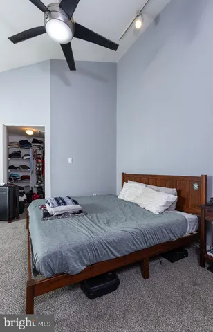 a bedroom with a bed and a walk in closet